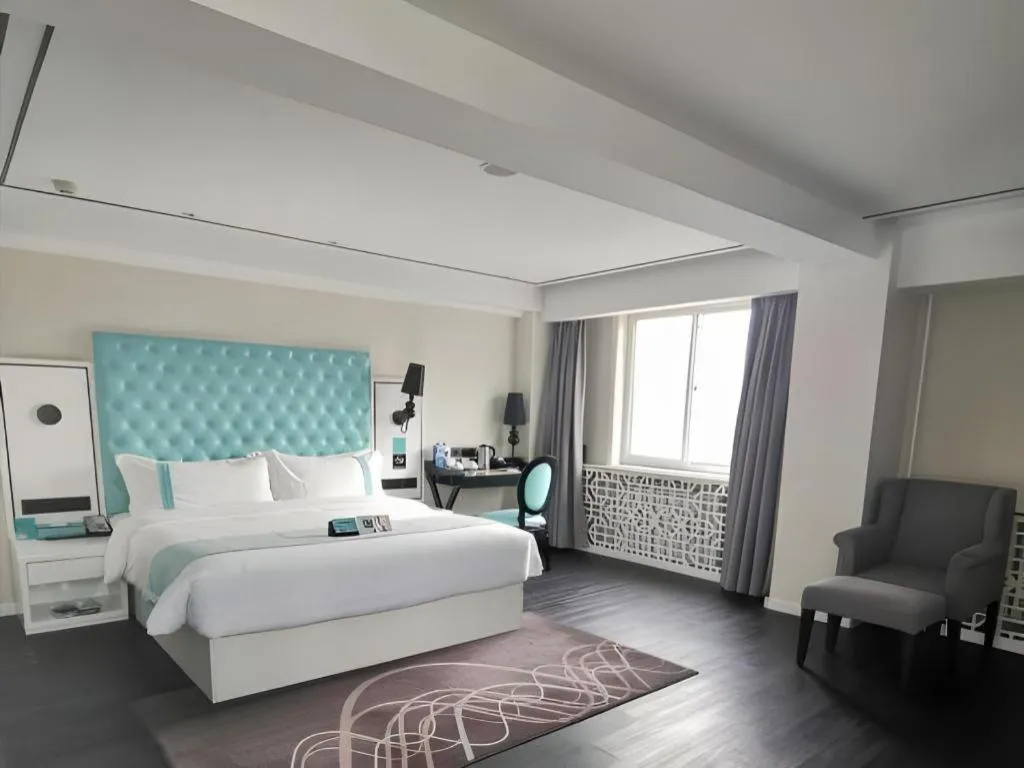 Bed in Xana Hotelle Beijing Qianmen Footbridge Metro Station