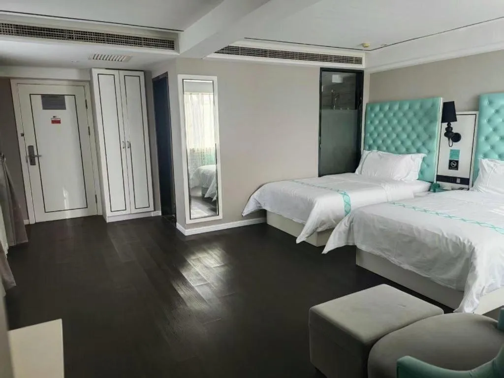 Bed in Xana Hotelle Beijing Qianmen Footbridge Metro Station