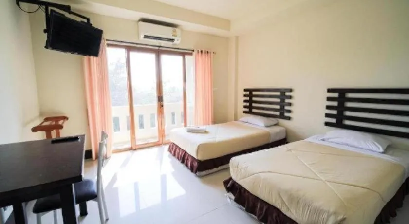 Bed in AmornSukhothai Hotel