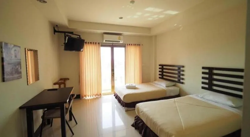 Bed in AmornSukhothai Hotel