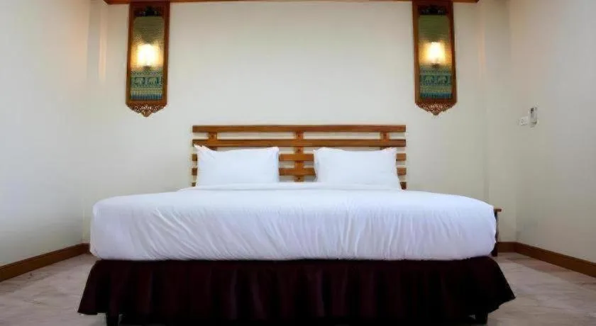 Bed in AmornSukhothai Hotel