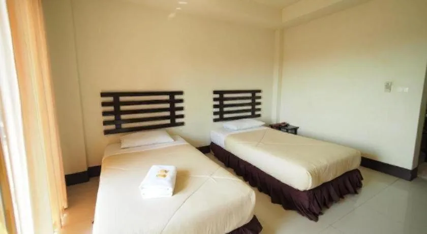 Bed in AmornSukhothai Hotel