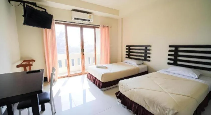 Bed in AmornSukhothai Hotel