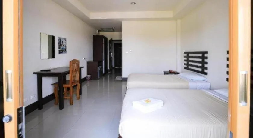 Bed in AmornSukhothai Hotel