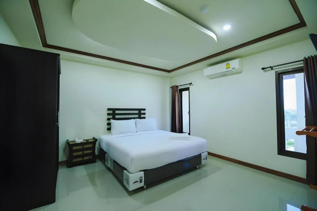 Bed in AmornSukhothai Hotel
