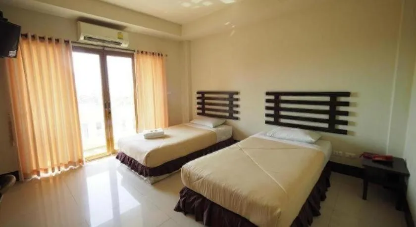 Bed in AmornSukhothai Hotel