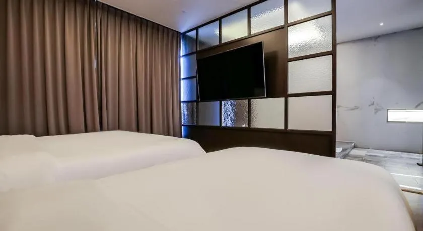 Bed in Hotel Morning Calm