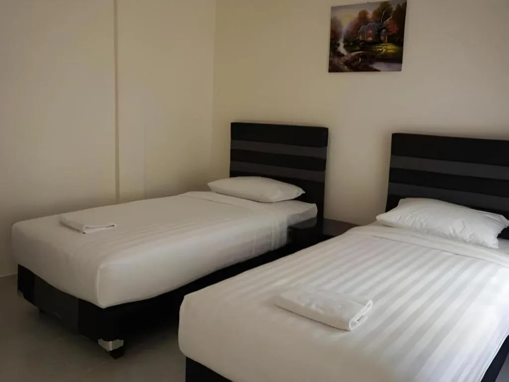 Bed in The Garden Hotel