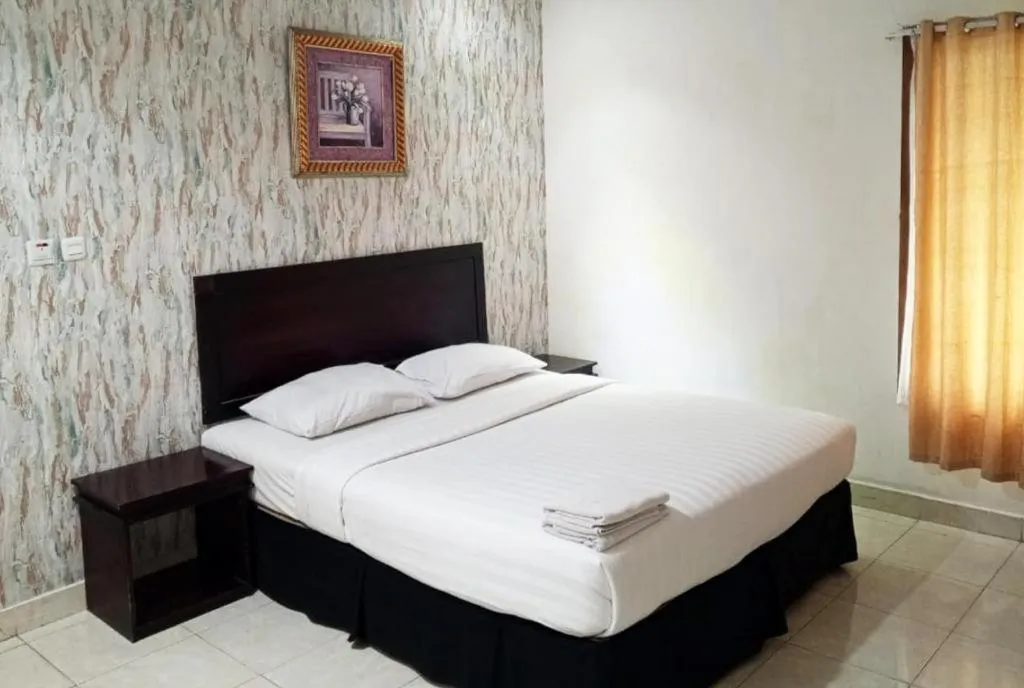 Bed in The Garden Hotel