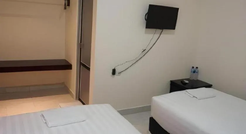 Bed in The Garden Hotel