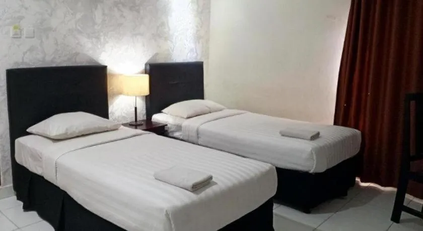 Bed in The Garden Hotel