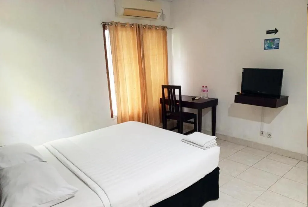 Bed in The Garden Hotel