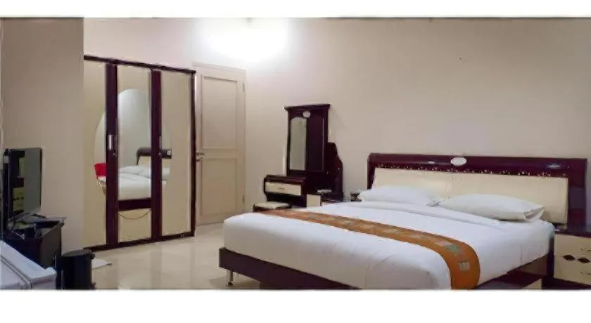 Bed in The Garden Hotel