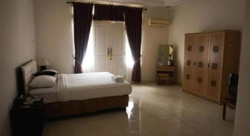 Bed in The Garden Hotel