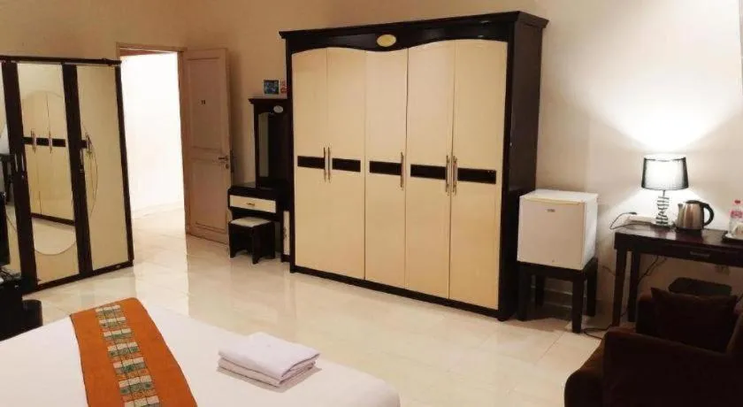 Bed in The Garden Hotel