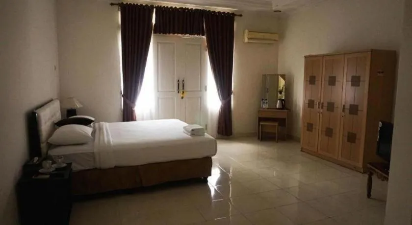 Bed in The Garden Hotel