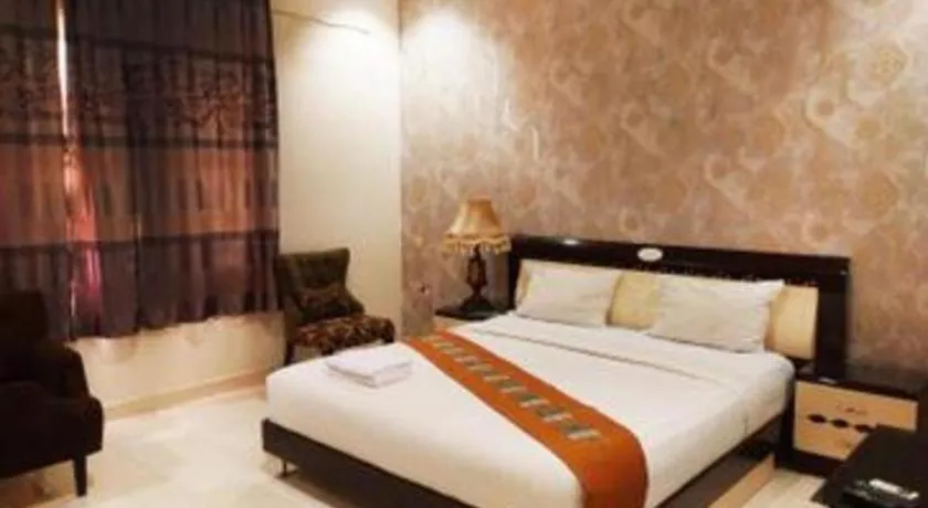 Bed in The Garden Hotel