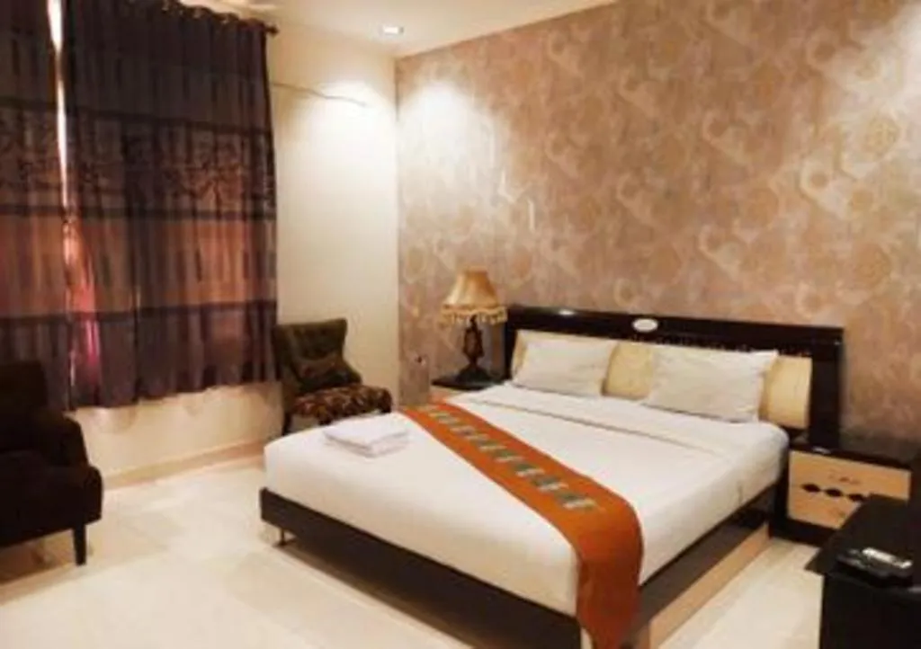 Bed in The Garden Hotel