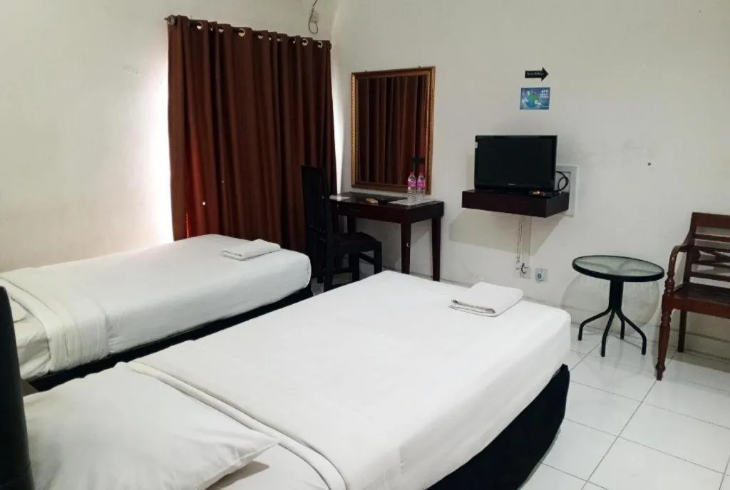 Bed in The Garden Hotel