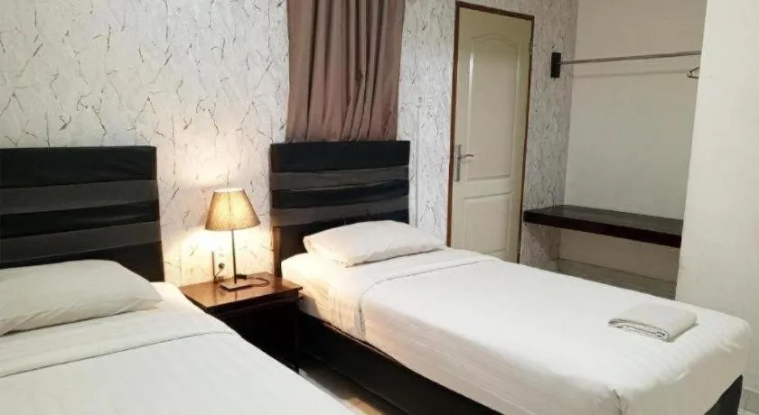 Bed in The Garden Hotel