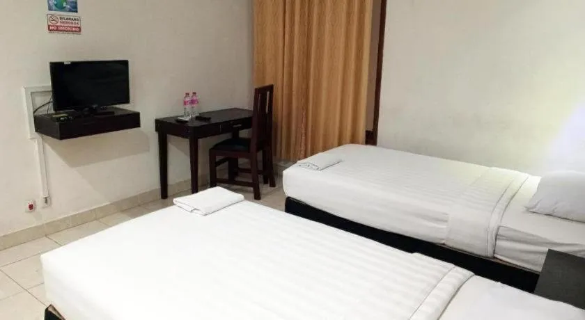 Bed in The Garden Hotel