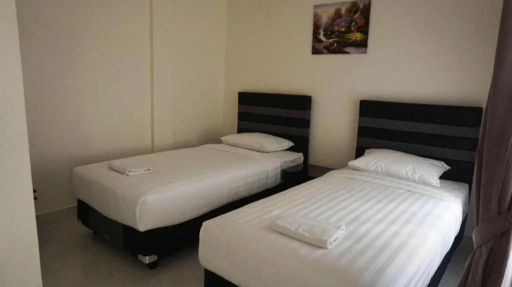 Bed in The Garden Hotel