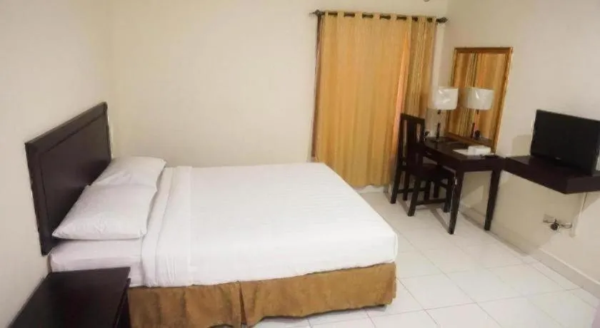 Bed in The Garden Hotel