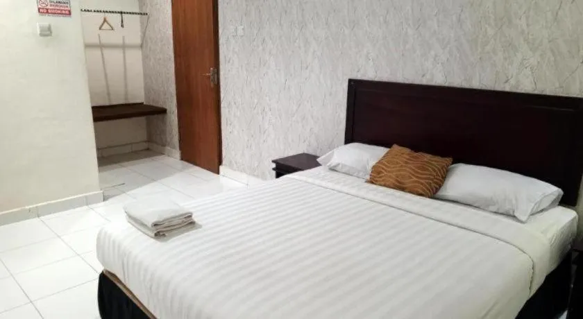 Bed in The Garden Hotel