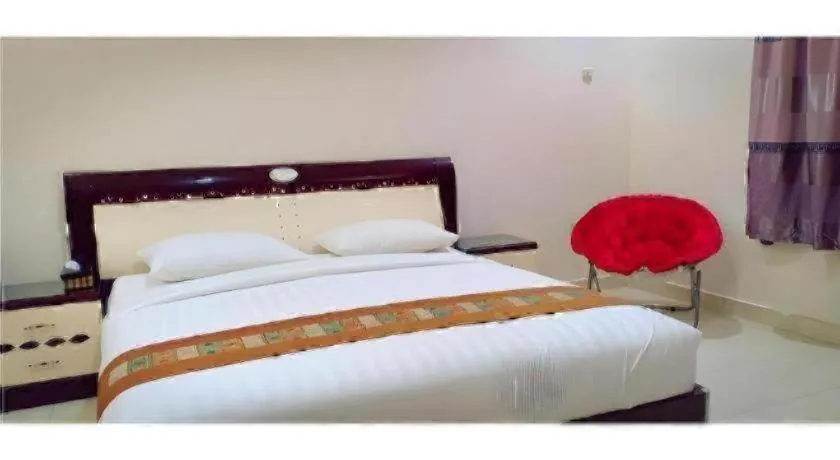 Bed in The Garden Hotel