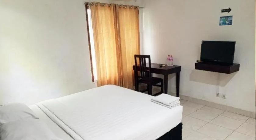 Bed in The Garden Hotel