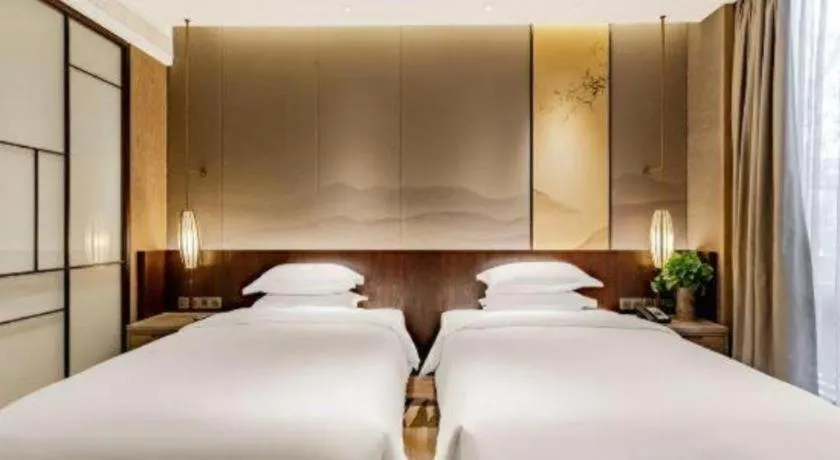 Bed in Wuxi Shanse Hotel