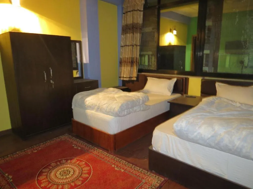 Bed in OYO 414 Hotel Om