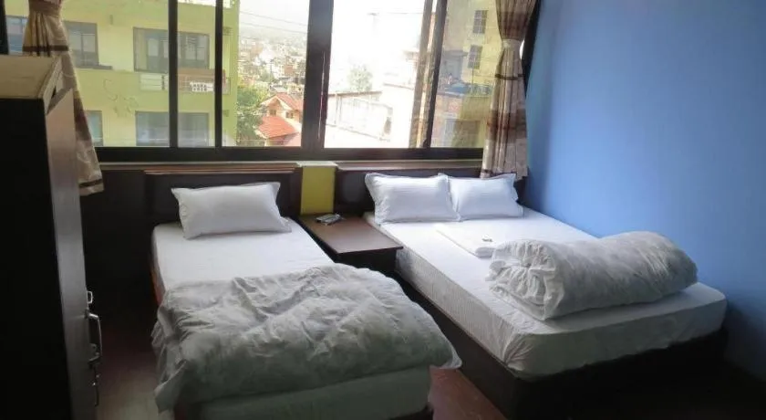 Bed in OYO 414 Hotel Om