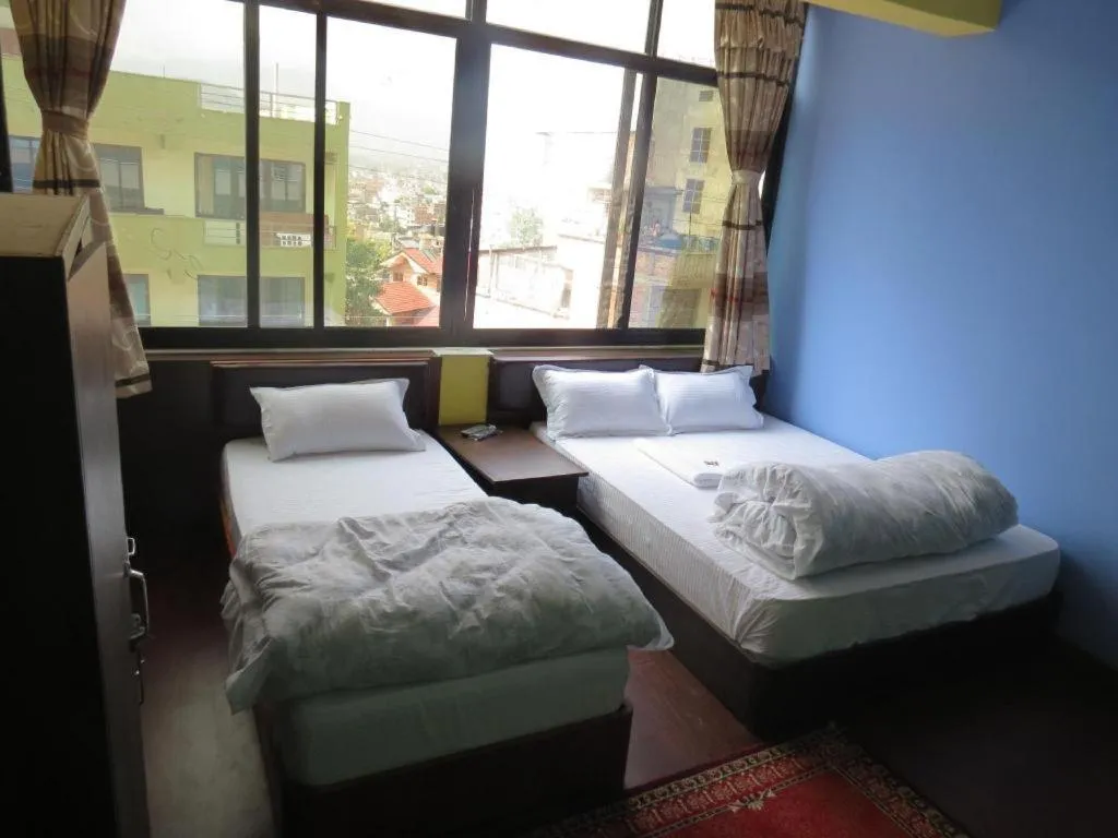 Bed in OYO 414 Hotel Om