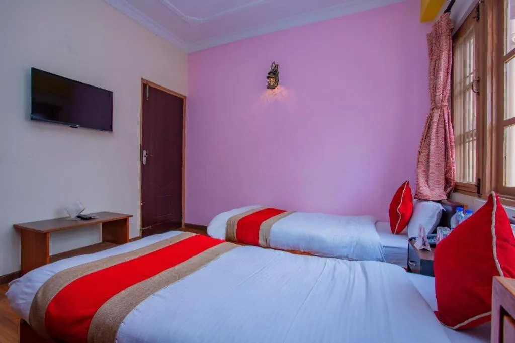 Bed in OYO 414 Hotel Om