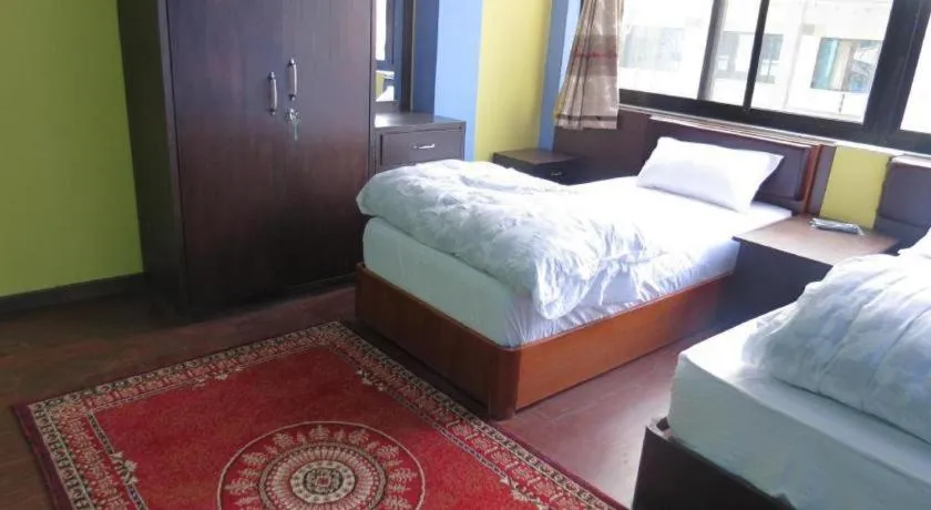 Bed in OYO 414 Hotel Om