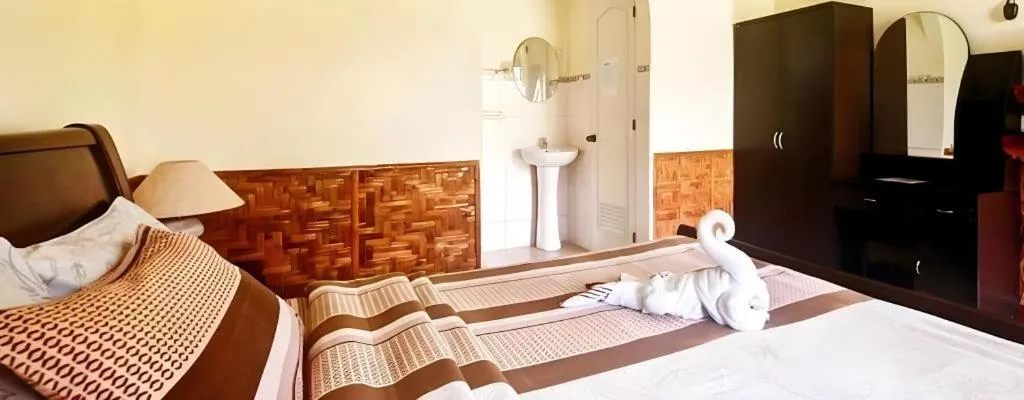 Bed in Coucou Bar Hotel and Restaurant