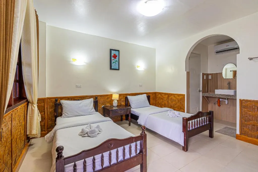 Bed in Coucou Bar Hotel and Restaurant