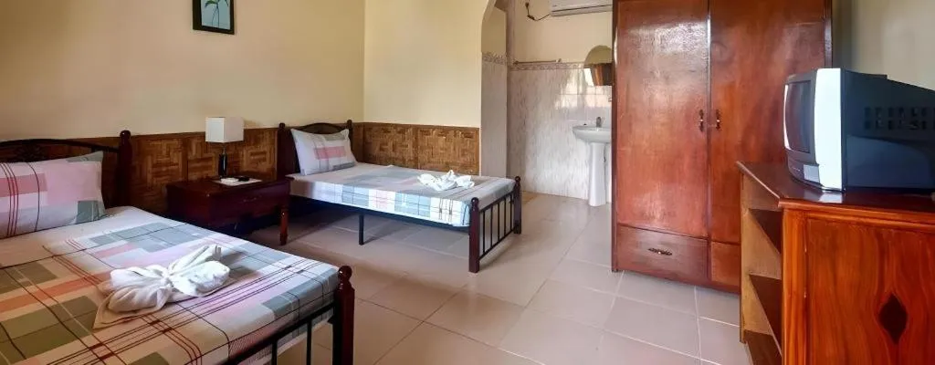 Bed in Coucou Bar Hotel and Restaurant