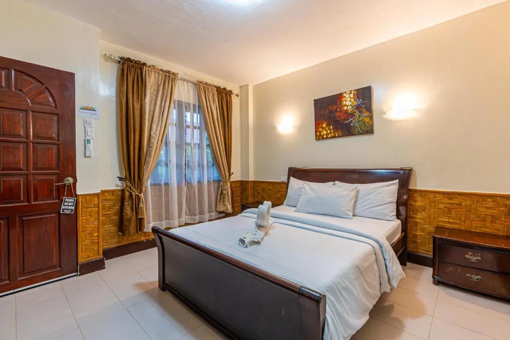 Bed in Coucou Bar Hotel and Restaurant