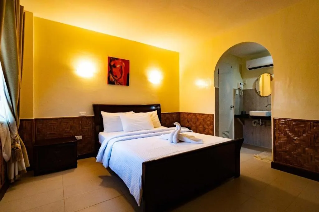 Bed in Coucou Bar Hotel and Restaurant