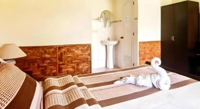 Bed in Coucou Bar Hotel and Restaurant