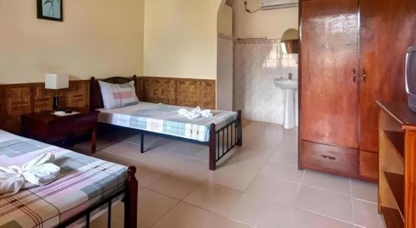 Bed in Coucou Bar Hotel and Restaurant