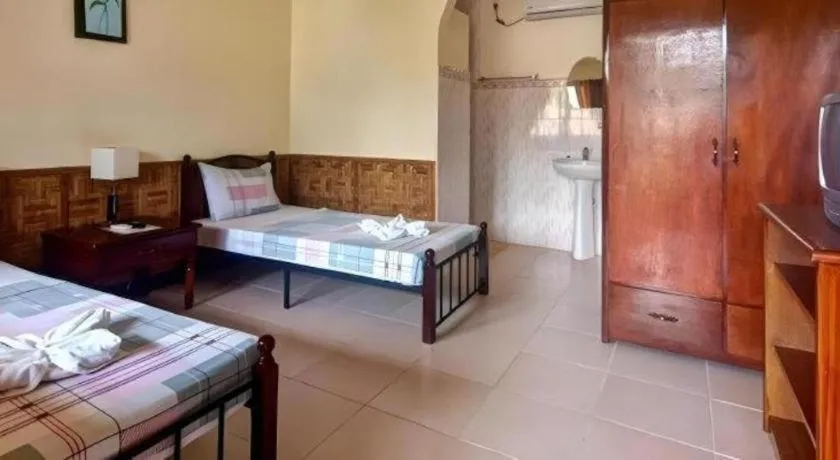 Bed in Coucou Bar Hotel and Restaurant