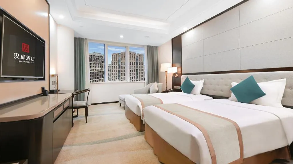 Bed in Hundred Hotel Qingdao