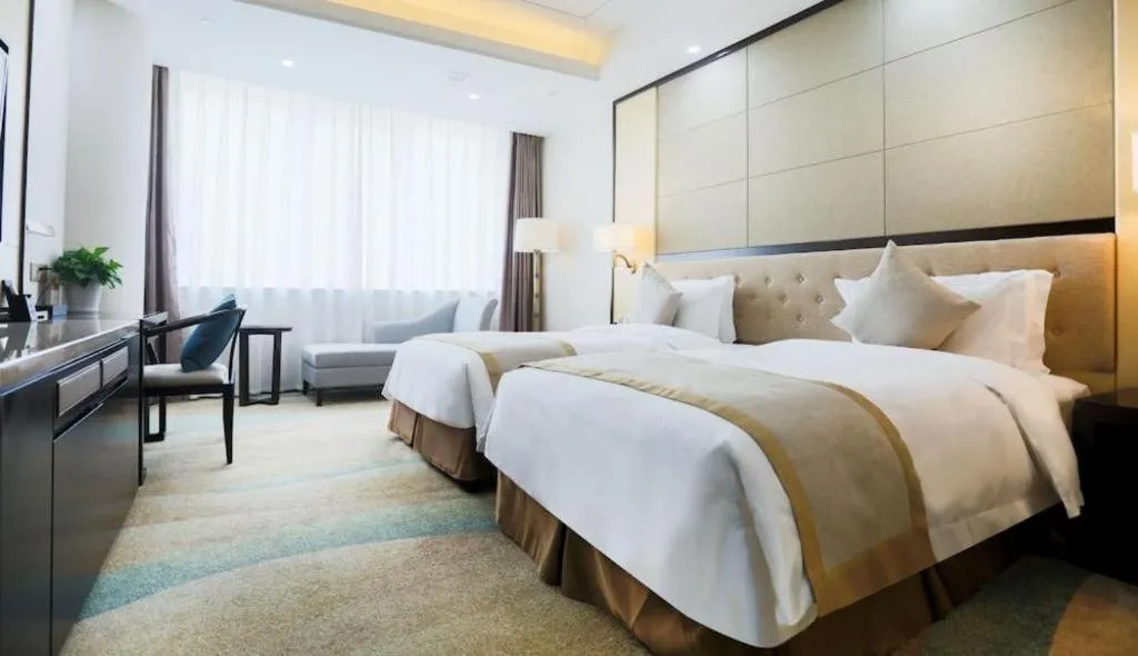 Bed in Hundred Hotel Qingdao