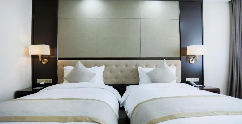 Bed in Hundred Hotel Qingdao