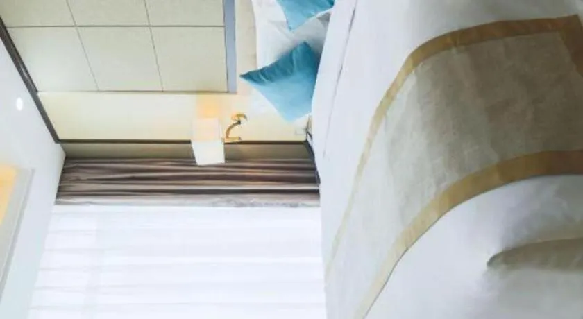 Bed in Hundred Hotel Qingdao