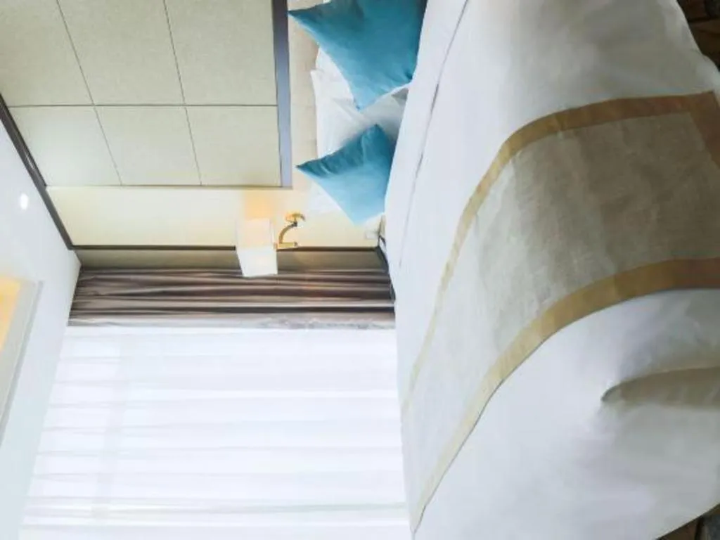 Bed in Hundred Hotel Qingdao