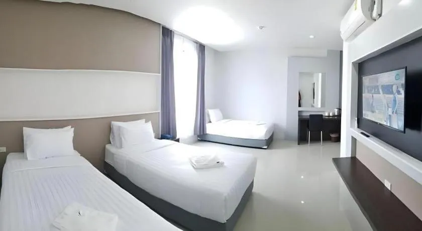 Bed in S-Tawan Hotel & Convention